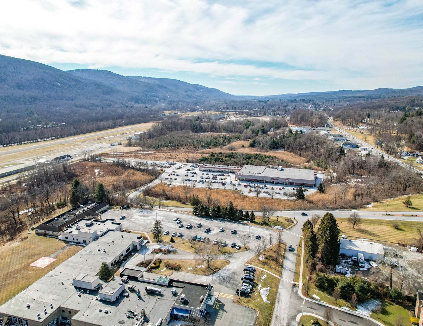 Grocery-anchored neighborhood shopping center, aerial view